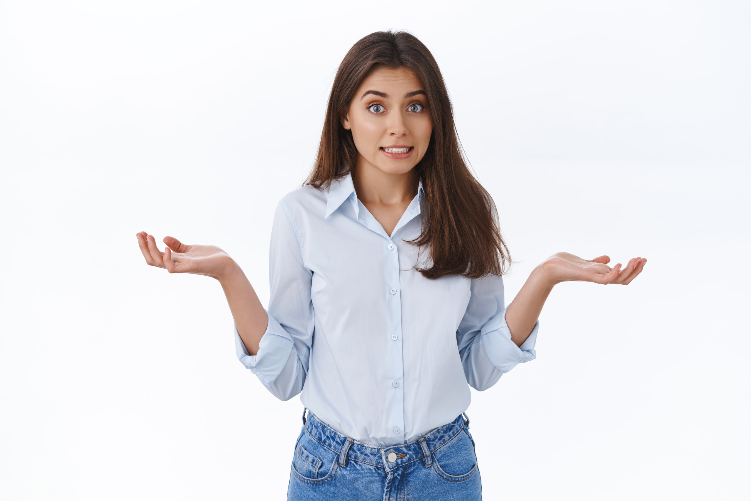 Sorry for making mistake didnt know. Clumsy cute assistant apologizing for forgetting something, shrug with hands spread sideways and embarrassed smile, standing awkward white background.